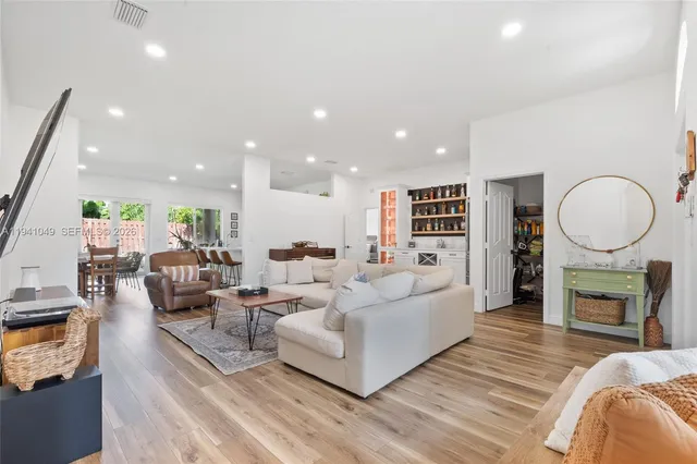 a living room with fireplace furniture and a fireplace