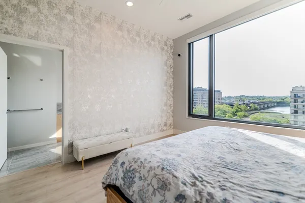 a view of bedroom and bedroom with wooden floor