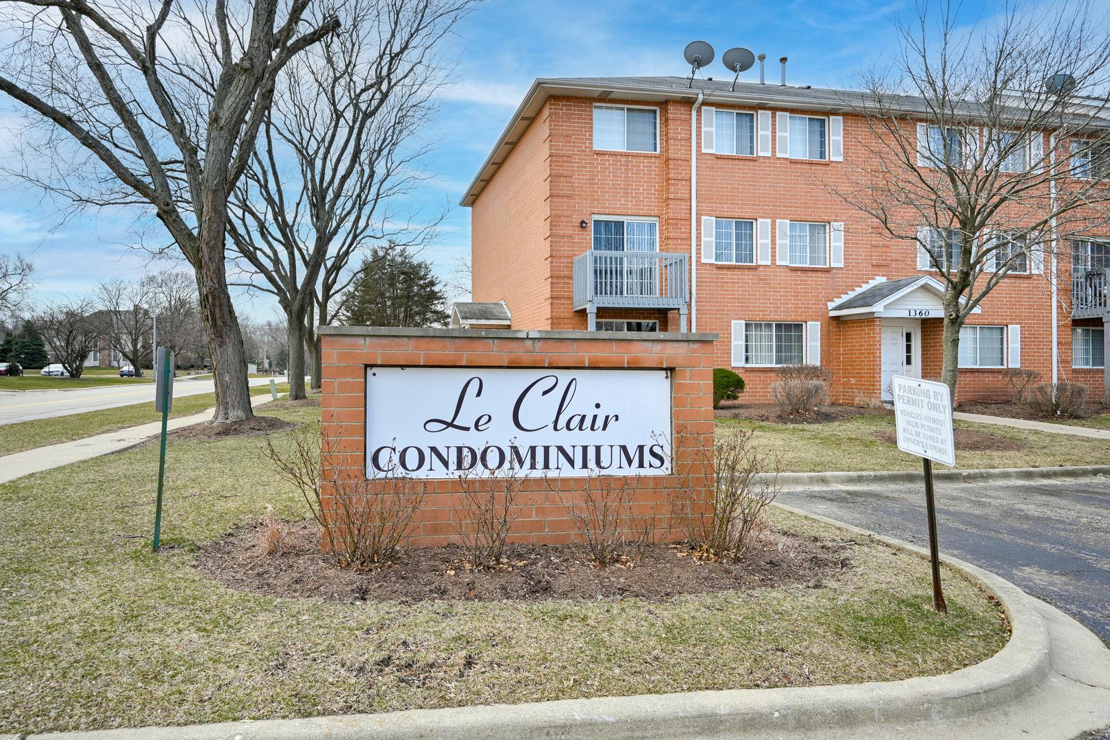 1360 South Lorraine Road, Unit C Wheaton, IL 60189 - Photo 1 of 1 a sign broad on the side of the road