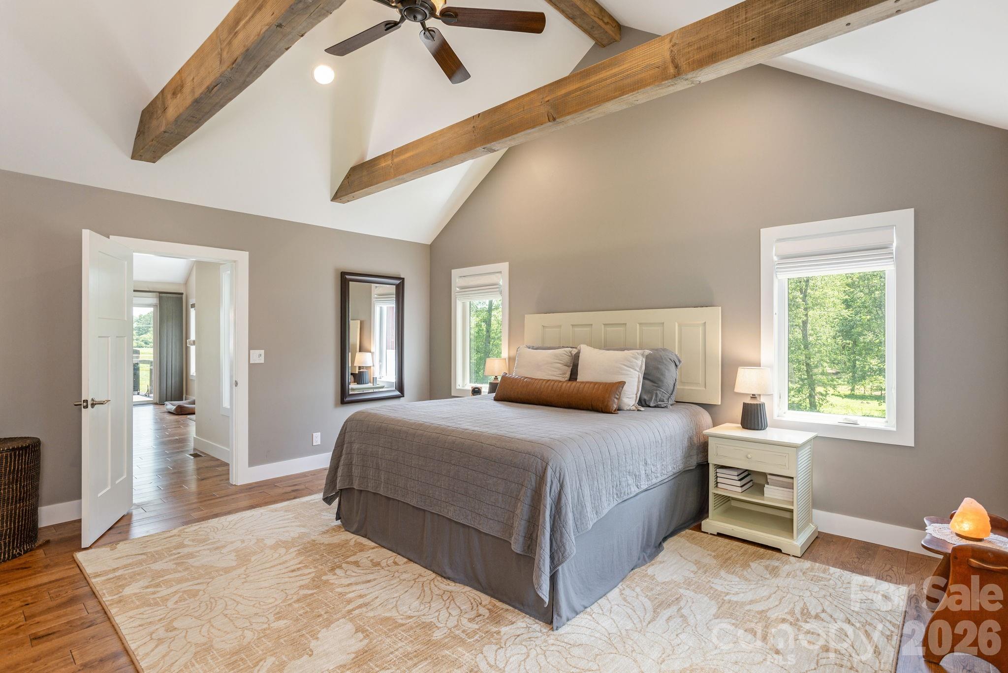 16 School House Road Mills River, NC 28759 - Photo 18 of 48 a bedroom with a bed and a dresser next to a window