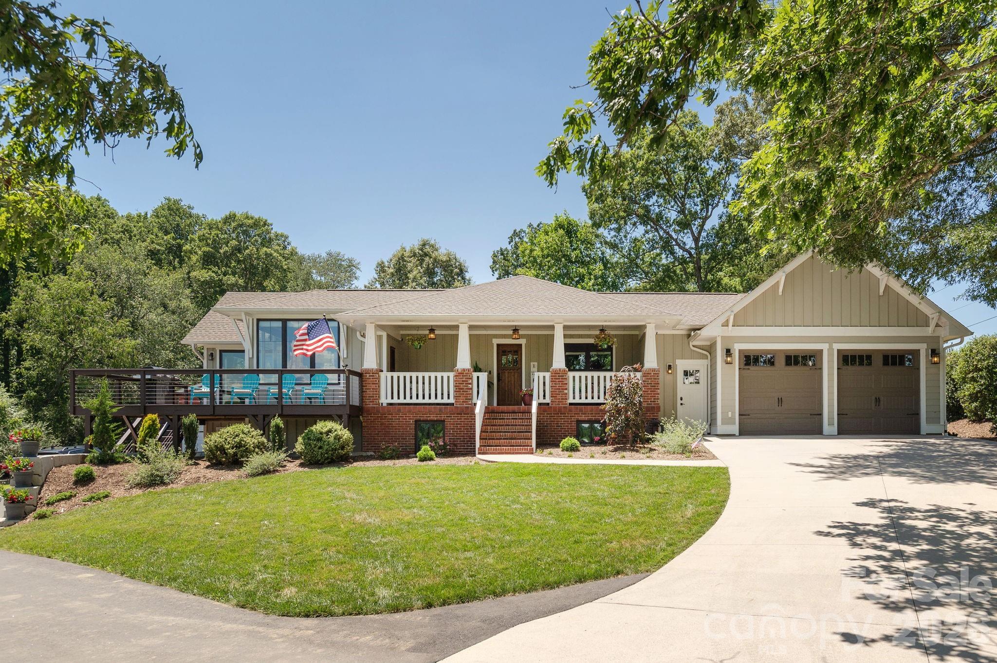 16 School House Road Mills River, NC 28759 - Photo 2 of 48 a front view of a house with a garden
