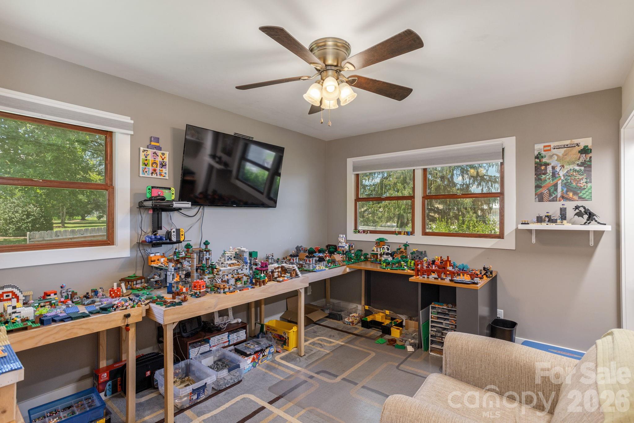 16 School House Road Mills River, NC 28759 - Photo 28 of 48 a room with furniture a flat screen tv and a window