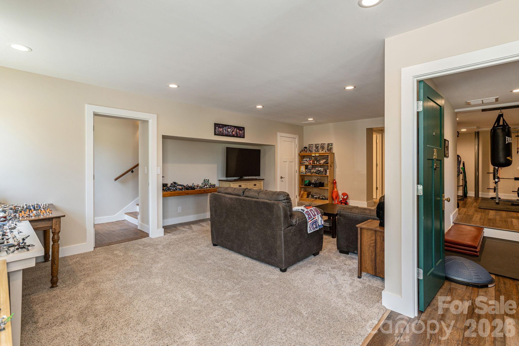 16 School House Road Mills River, NC 28759 - Photo 30 of 48 a living room with furniture and a flat screen tv