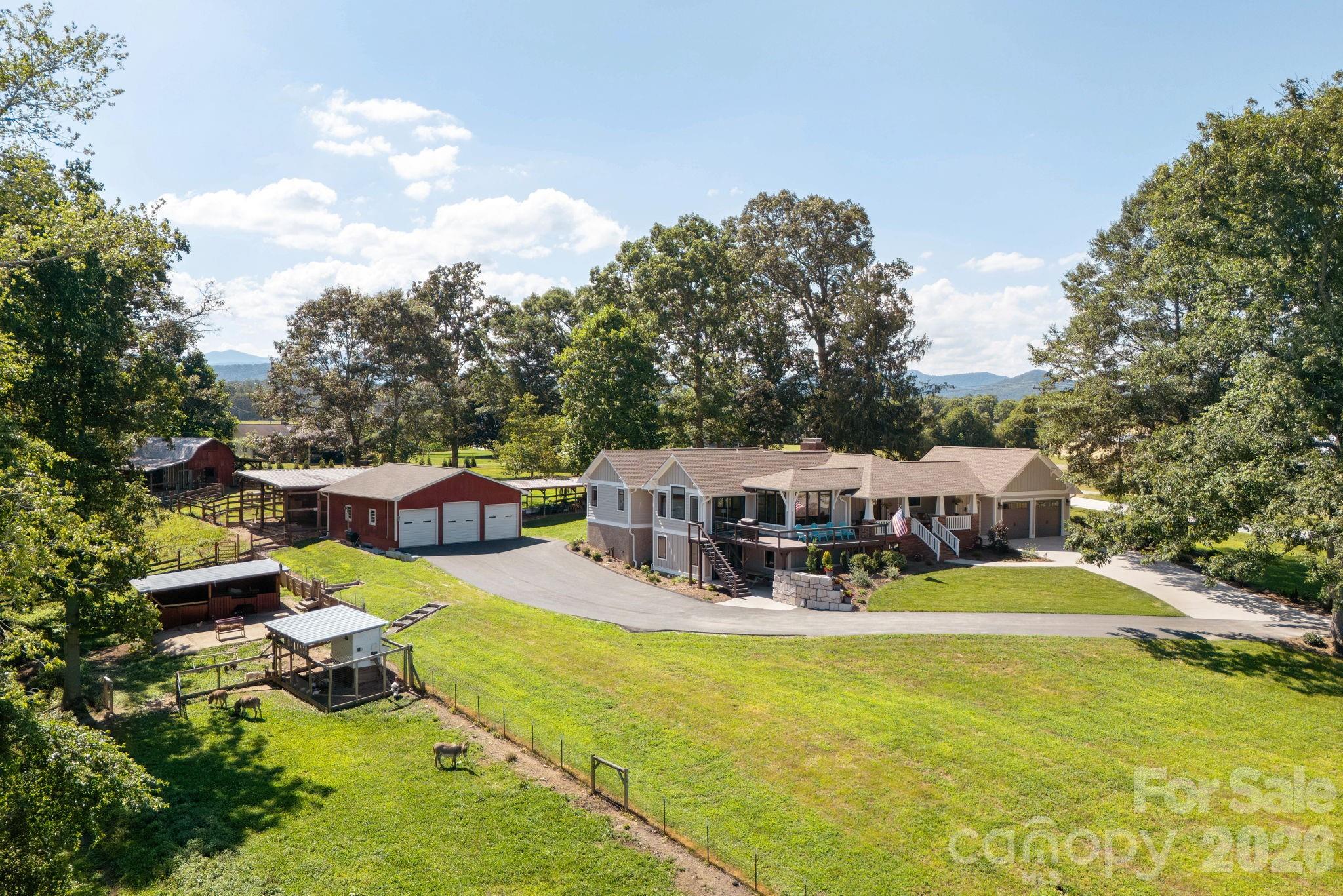 16 School House Road Mills River, NC 28759 - Photo 34 of 48 a view of a swimming pool with lawn chairs and a big yard