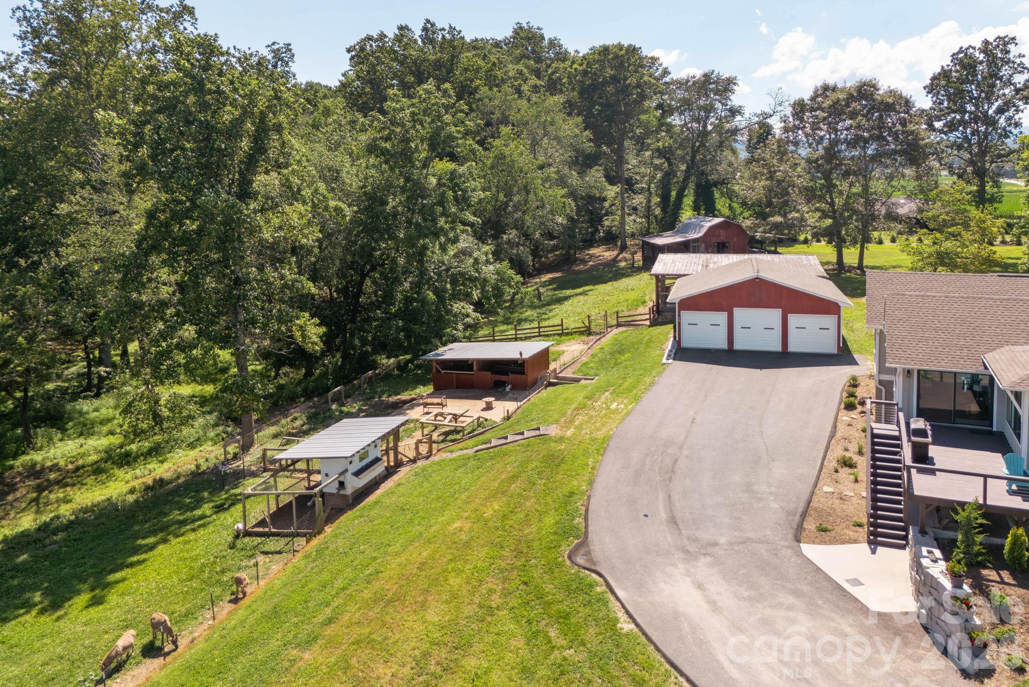 16 School House Road Mills River, NC 28759 - Photo 37 of 48 an aerial view of a house with swimming pool and large trees