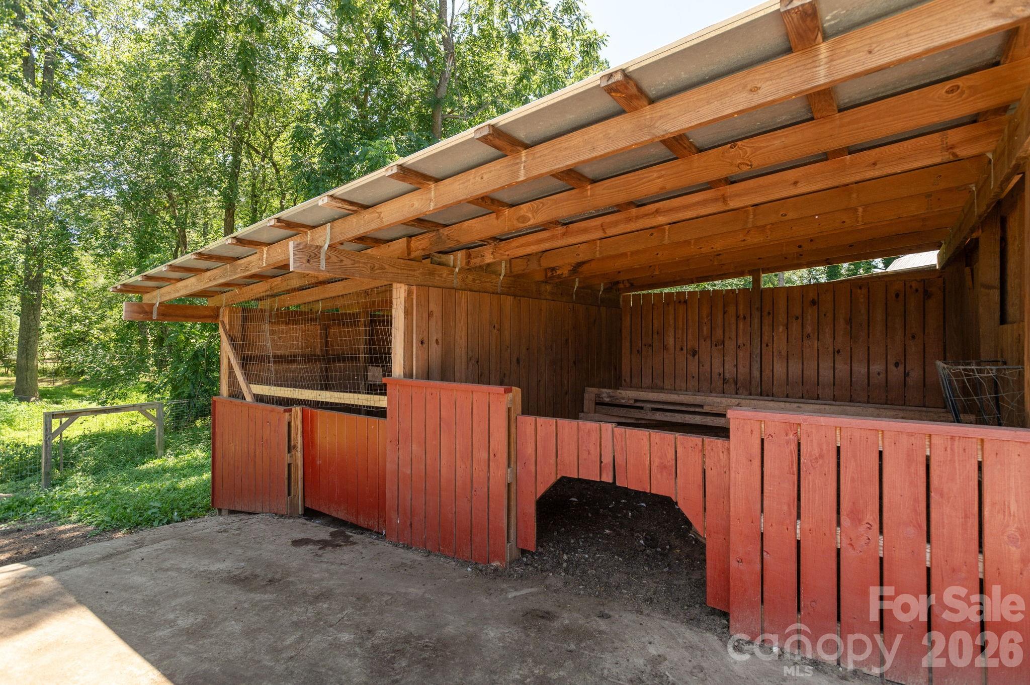 16 School House Road Mills River, NC 28759 - Photo 39 of 48 a view of a backyard with a small cabin and wooden fence