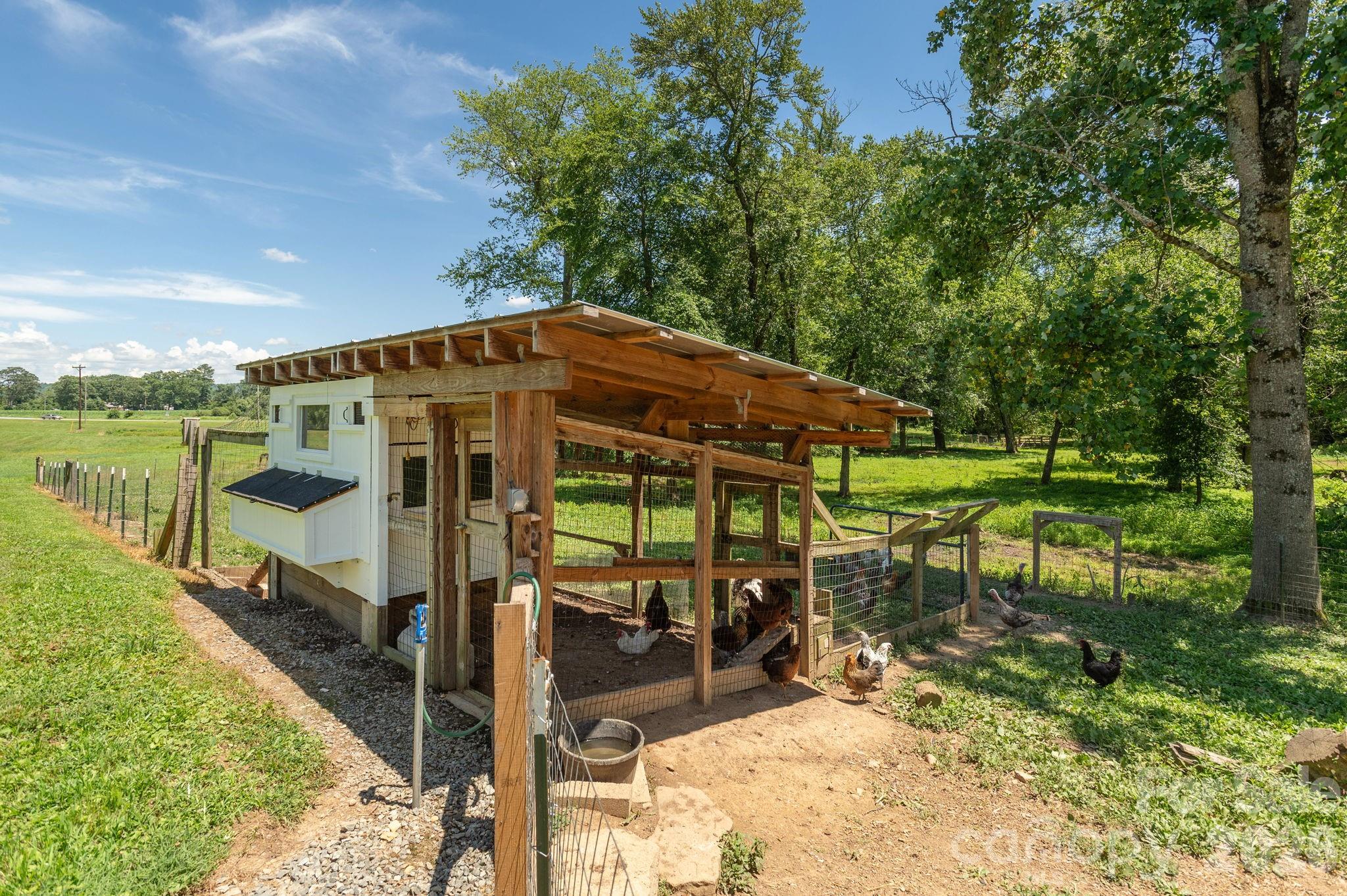 16 School House Road Mills River, NC 28759 - Photo 43 of 48 a view of a house with backyard and sitting area