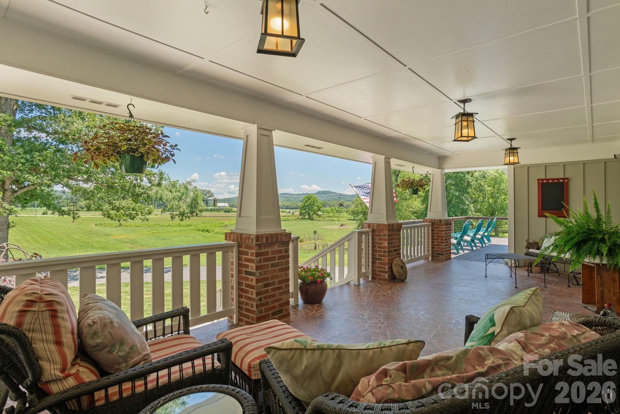 16 School House Road Mills River, NC 28759 - Photo 5 of 48 a balcony with furniture and garden view