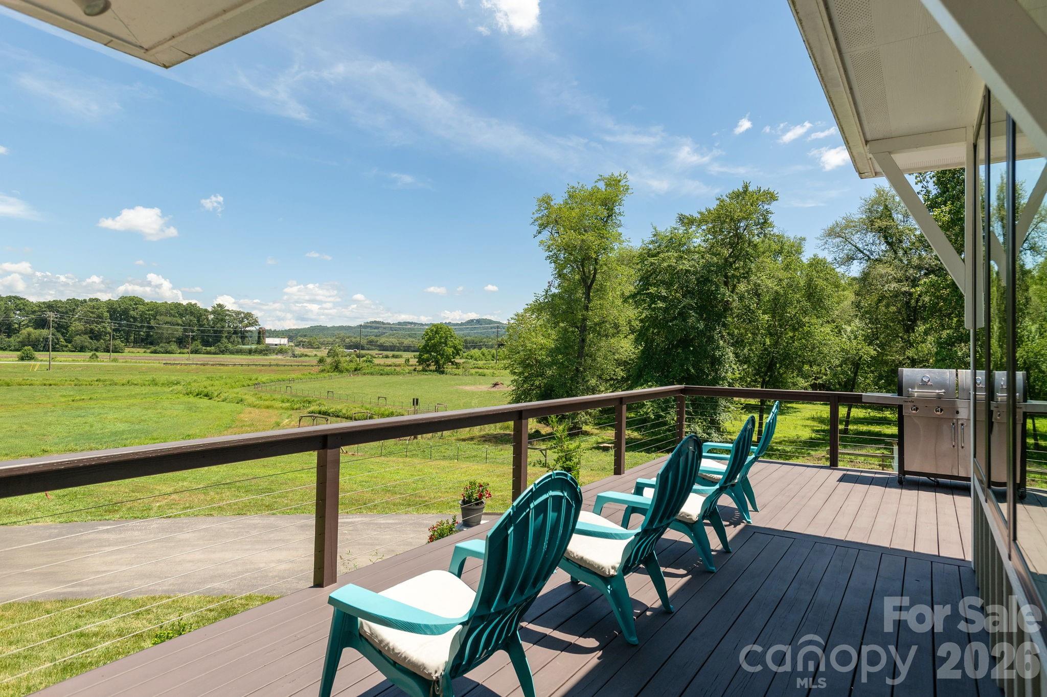 16 School House Road Mills River, NC 28759 - Photo 6 of 48 a view of a balcony with lake view and wooden floor
