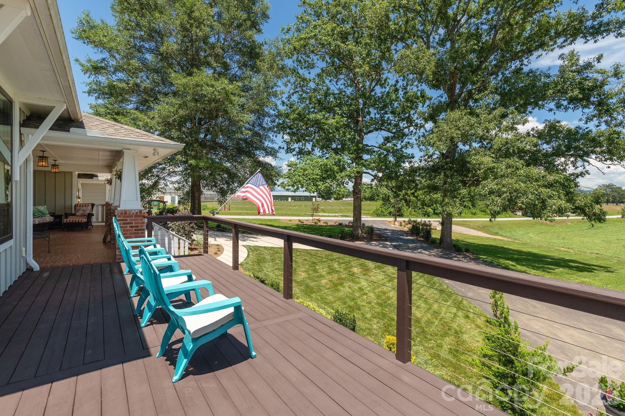 16 School House Road Mills River, NC 28759 - Photo 7 of 48 a view of a balcony with wooden floor and outdoor seating