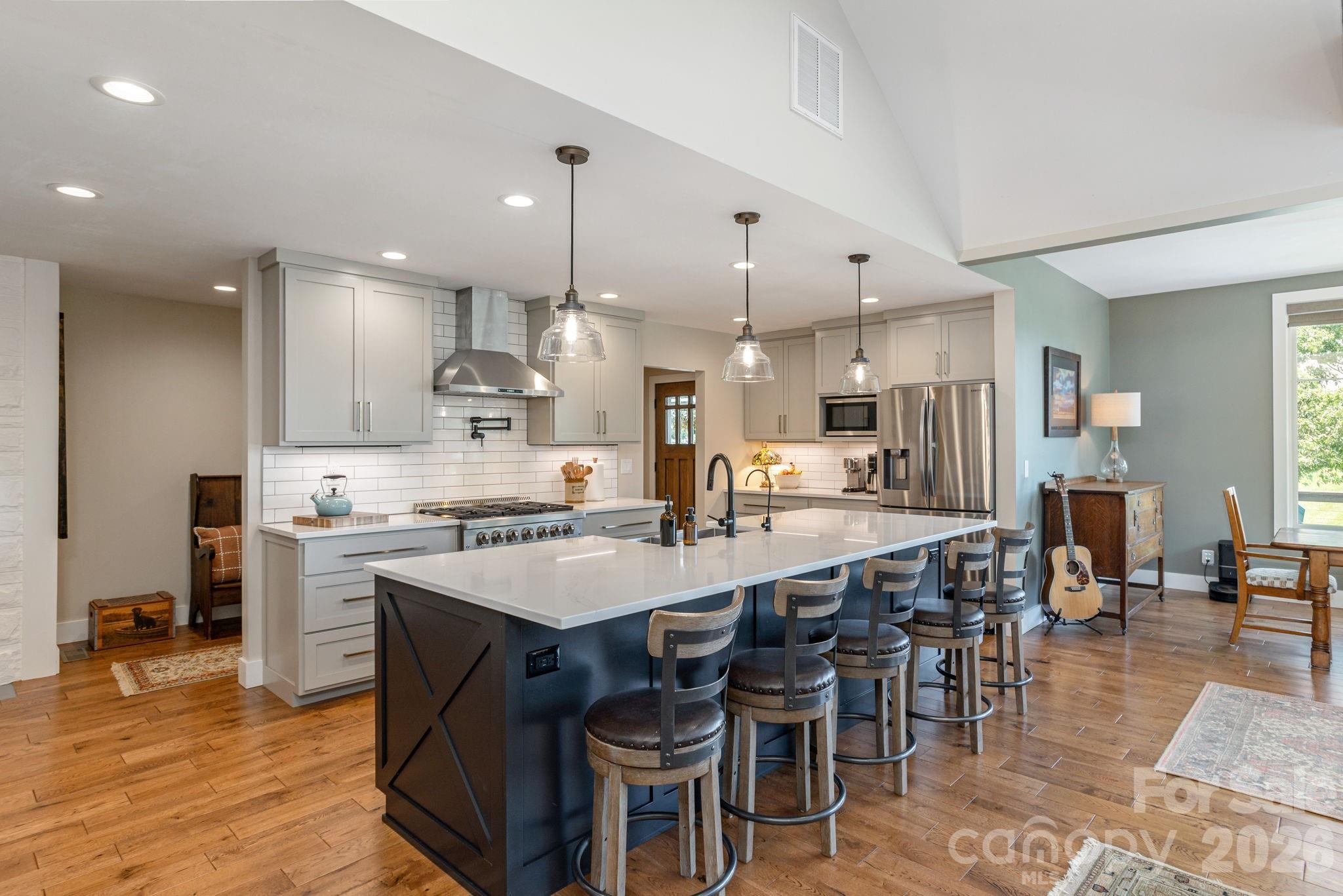 16 School House Road Mills River, NC 28759 - Photo 9 of 48 a large kitchen with a table and chairs