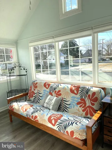 a bedroom with a bed and glass window