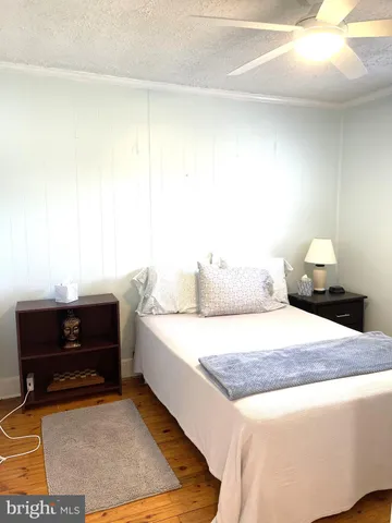 a living room with a bed and furniture