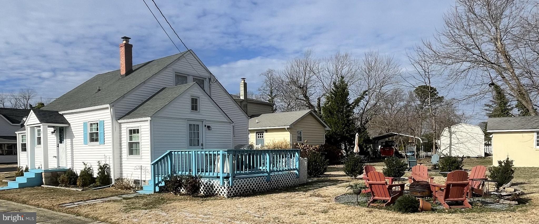 221 Madison Street Colonial Beach, VA 22443 - Photo 2 of 28 a front view of a house with a yard
