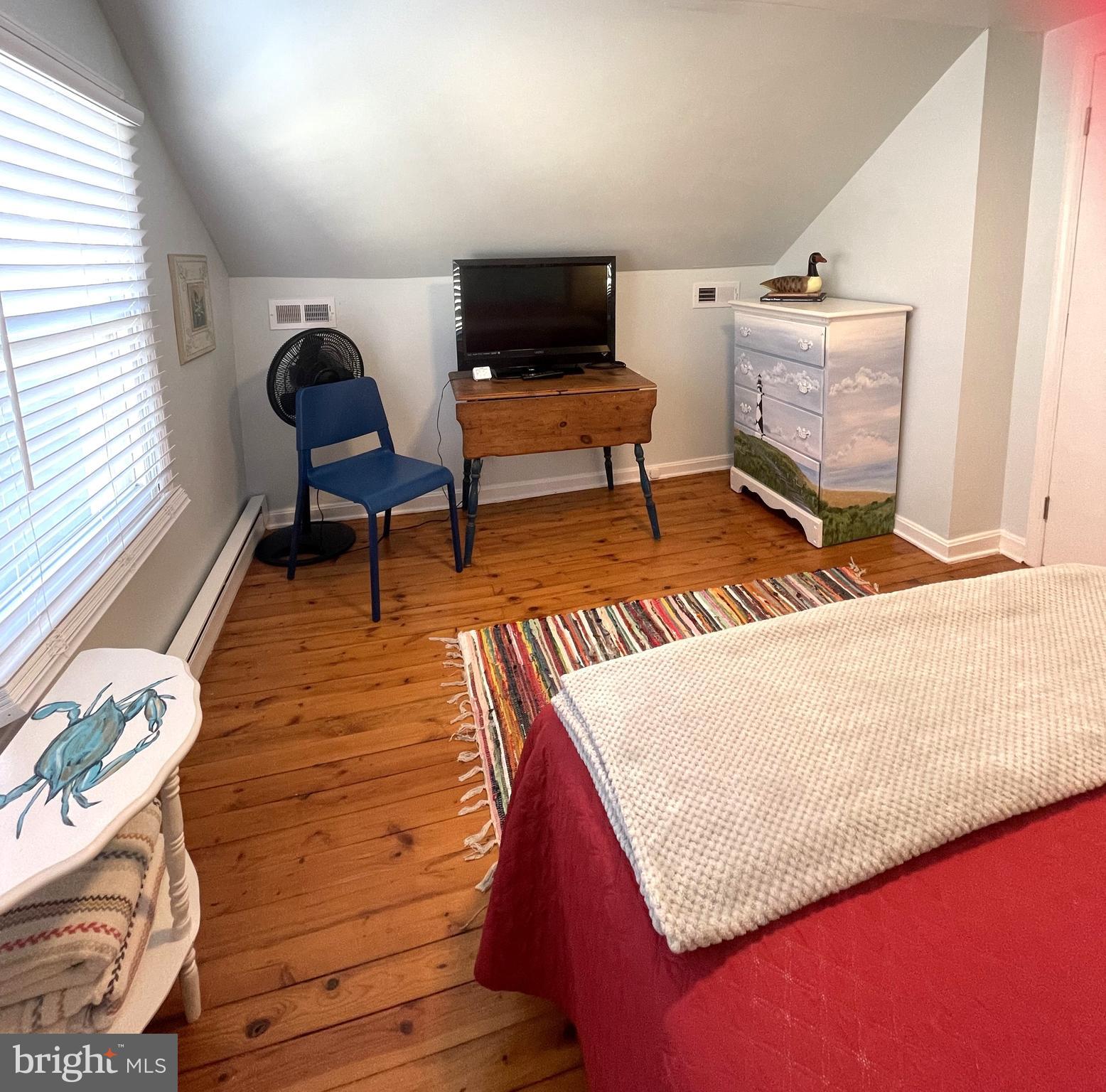 221 Madison Street Colonial Beach, VA 22443 - Photo 26 of 28 a living room with furniture and a wooden floor