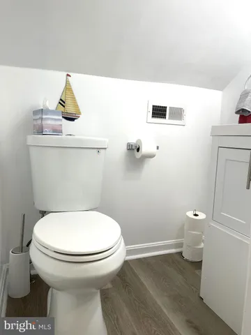 a bathroom with a toilet and a sink