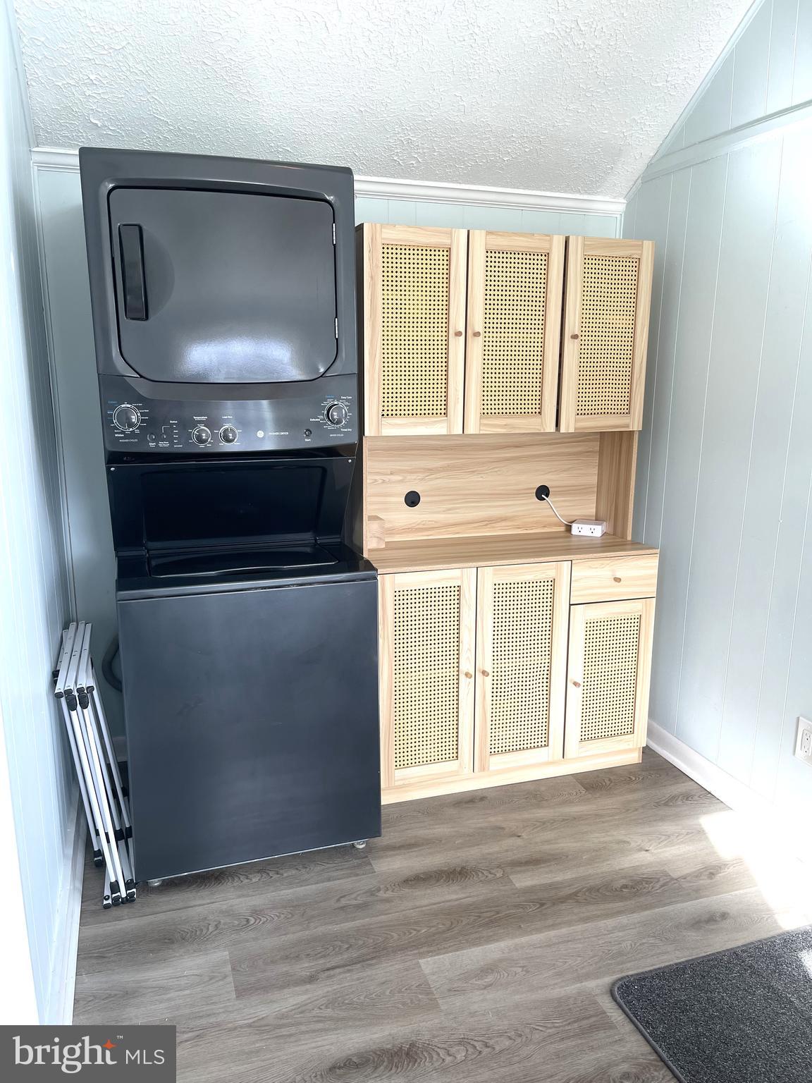 221 Madison Street Colonial Beach, VA 22443 - Photo 9 of 28 a kitchen with a stove and a microwave