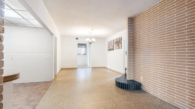 a large bathroom with a tub shower and sink
