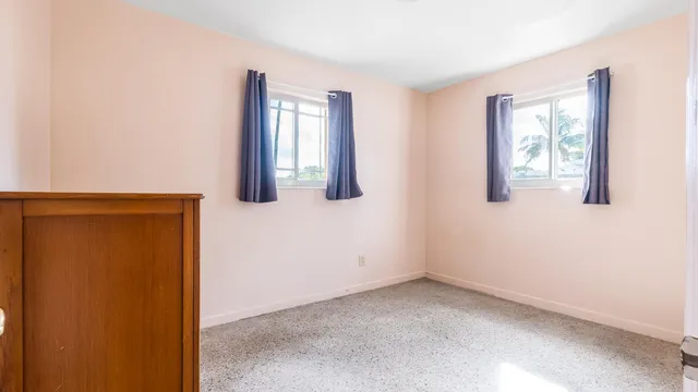 a kitchen with granite countertop a refrigerator and a sink