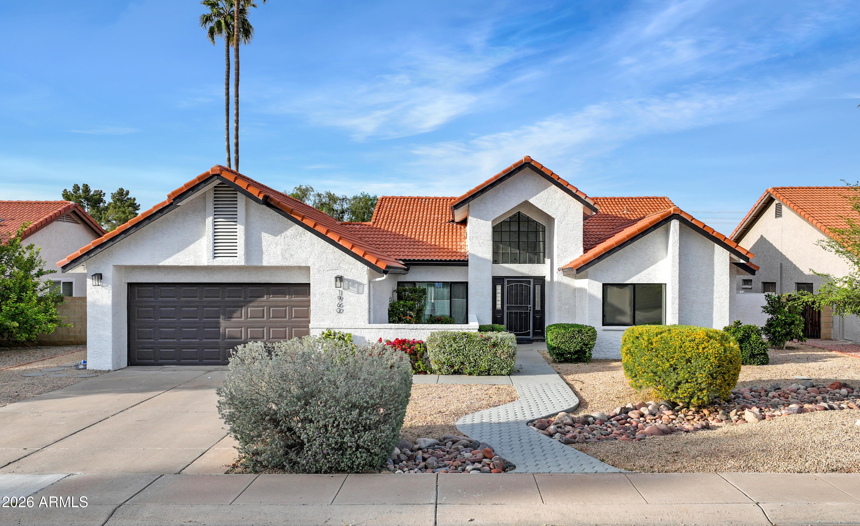 1960 East Krista Way Tempe, AZ 85284 - Photo 1 of 36 a front view of a house with a yard