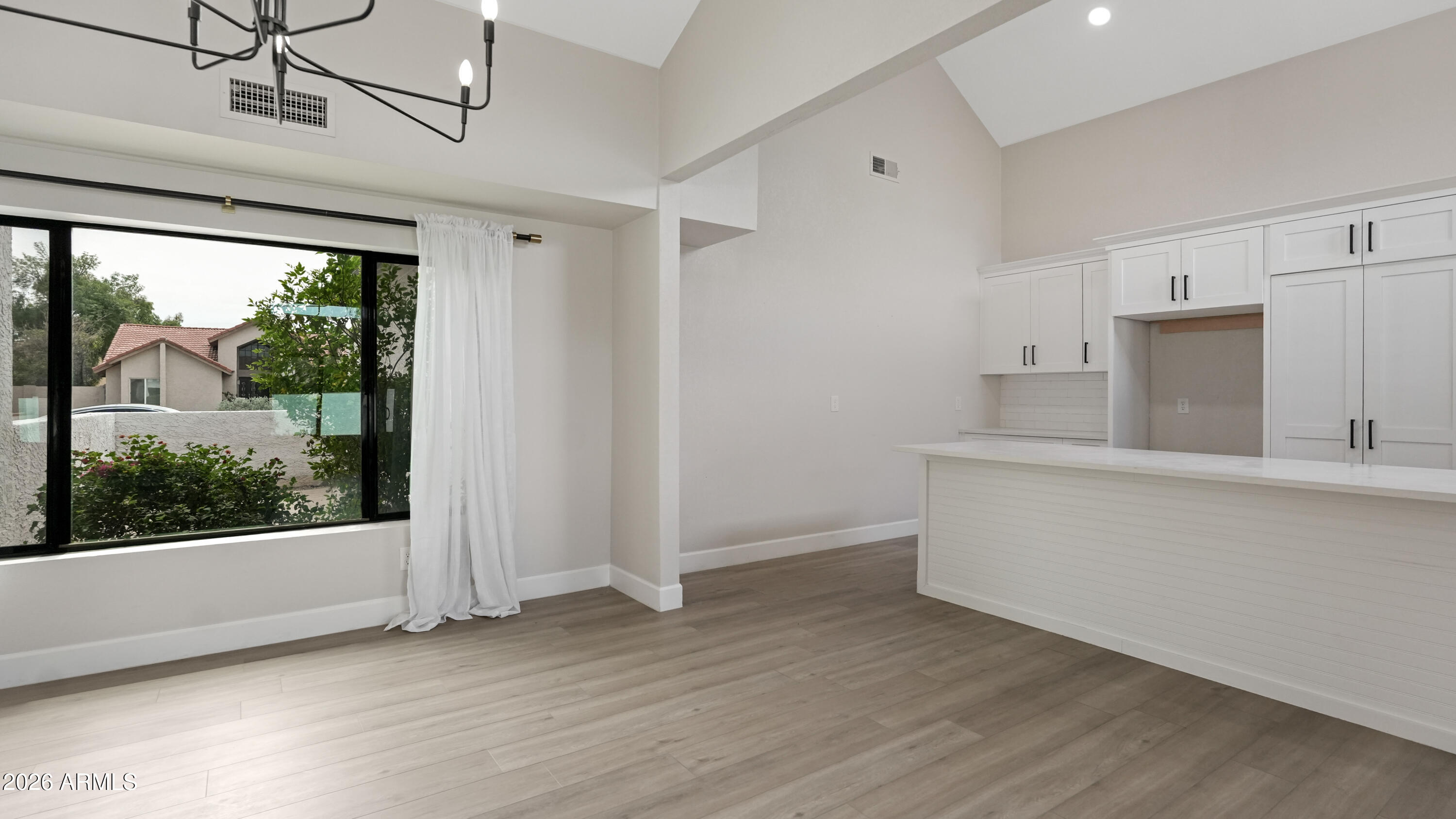 1960 East Krista Way Tempe, AZ 85284 - Photo 11 of 36 a view of room with window and hardwood floor