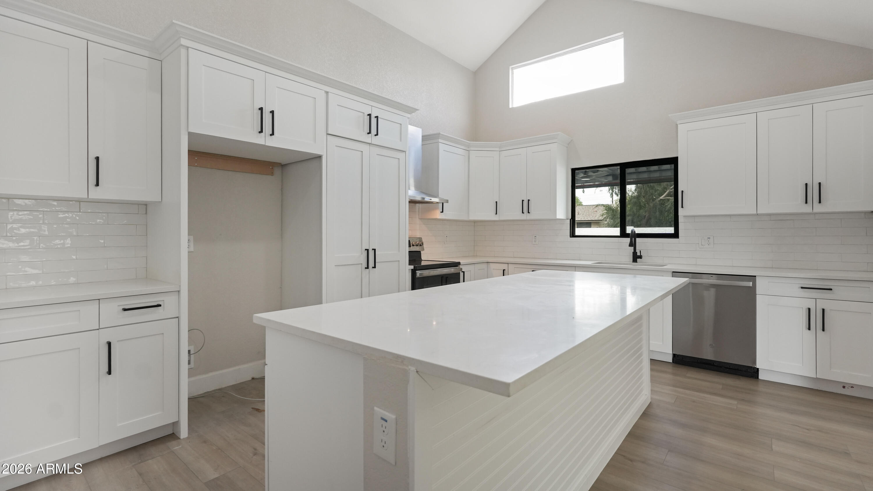 1960 East Krista Way Tempe, AZ 85284 - Photo 12 of 36 a large white kitchen with cabinets