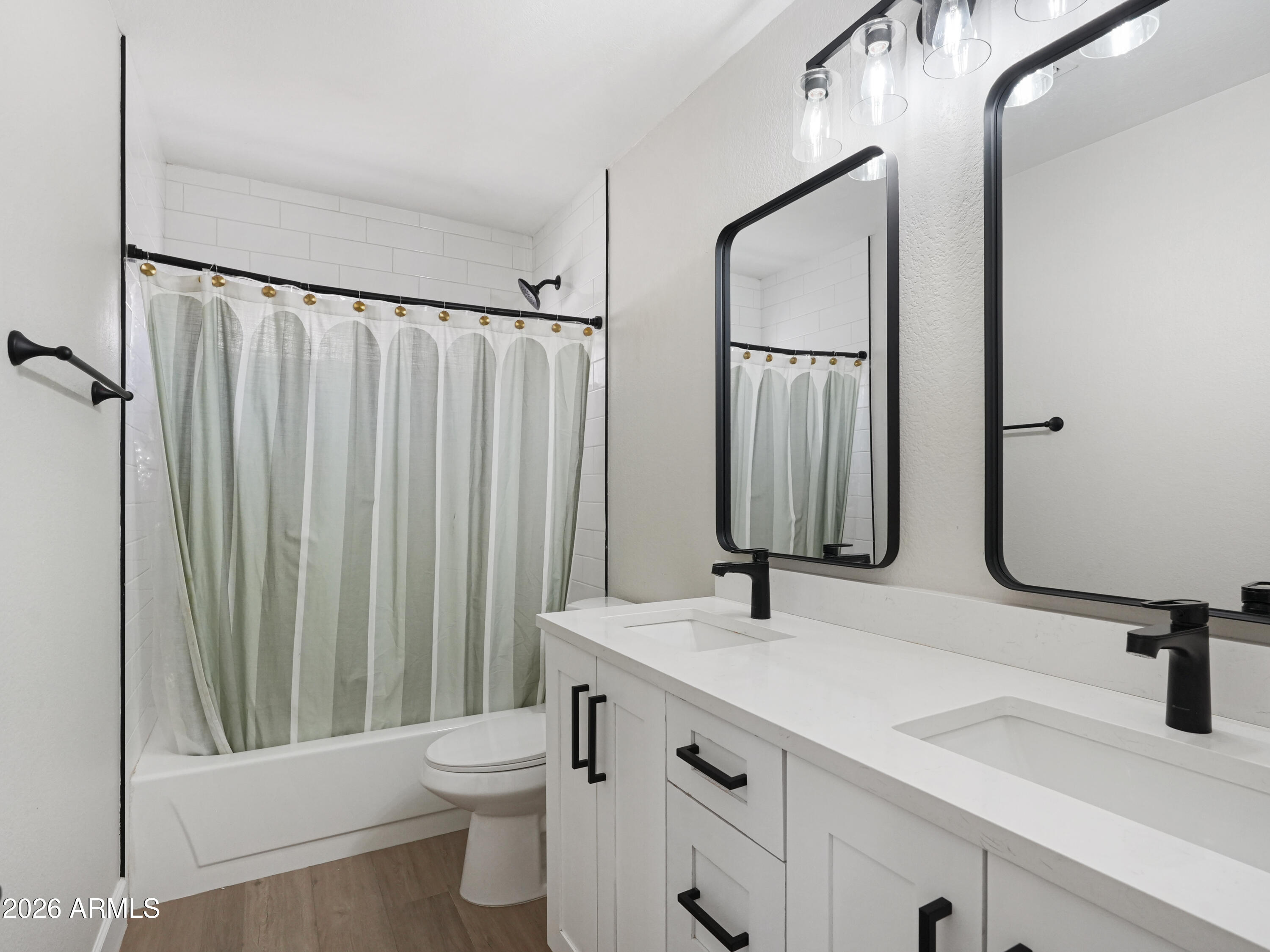 1960 East Krista Way Tempe, AZ 85284 - Photo 24 of 36 a bathroom with a double vanity sink toilet and a mirror