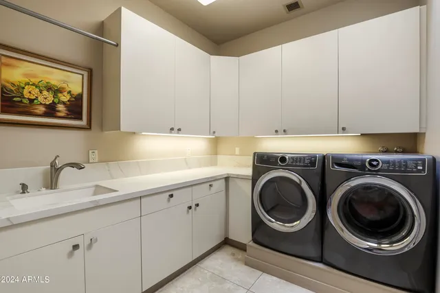 a view of a hallway with closet and a bathroom
