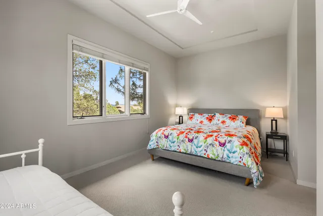 a front view of a house with glass windows and yard