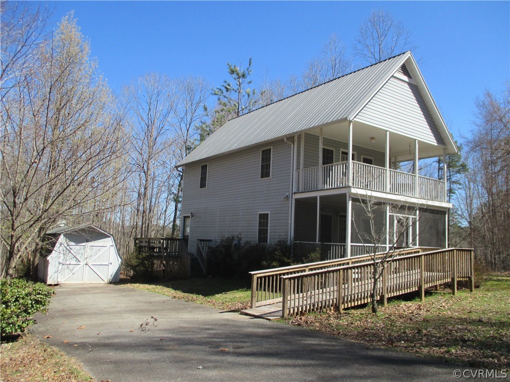 62 Falls Road Victoria, VA 23974 - Photo 1 of 36 a house with trees in the background