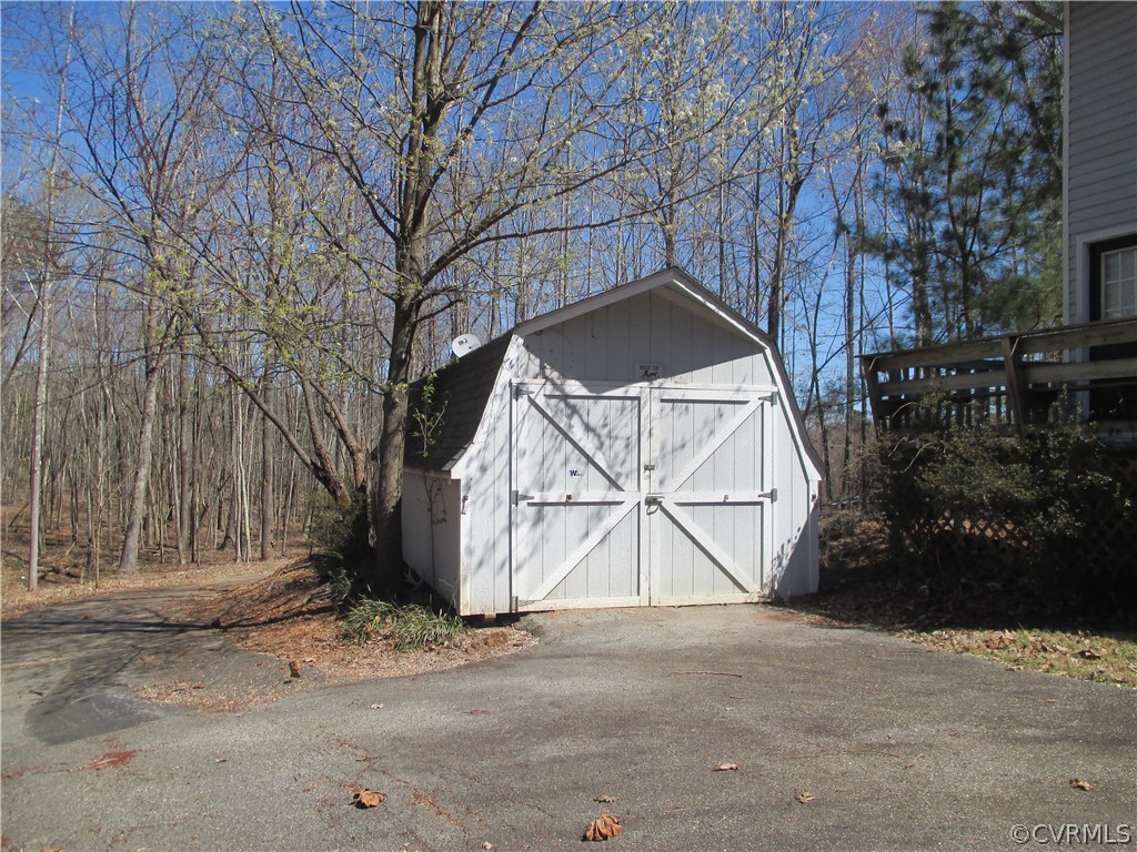 62 Falls Road Victoria, VA 23974 - Photo 13 of 36 a view of a wooden house with a snow on the road