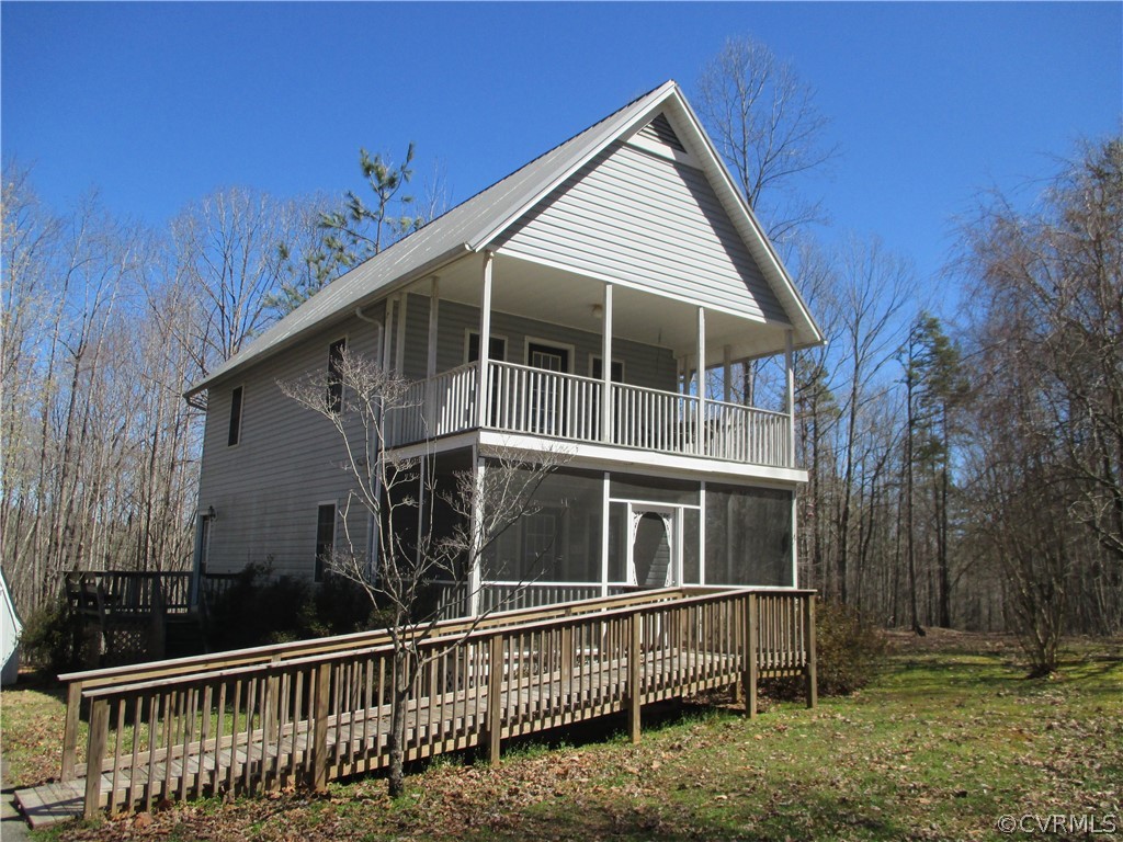 62 Falls Road Victoria, VA 23974 - Photo 2 of 36 a view of house with backyard and trees