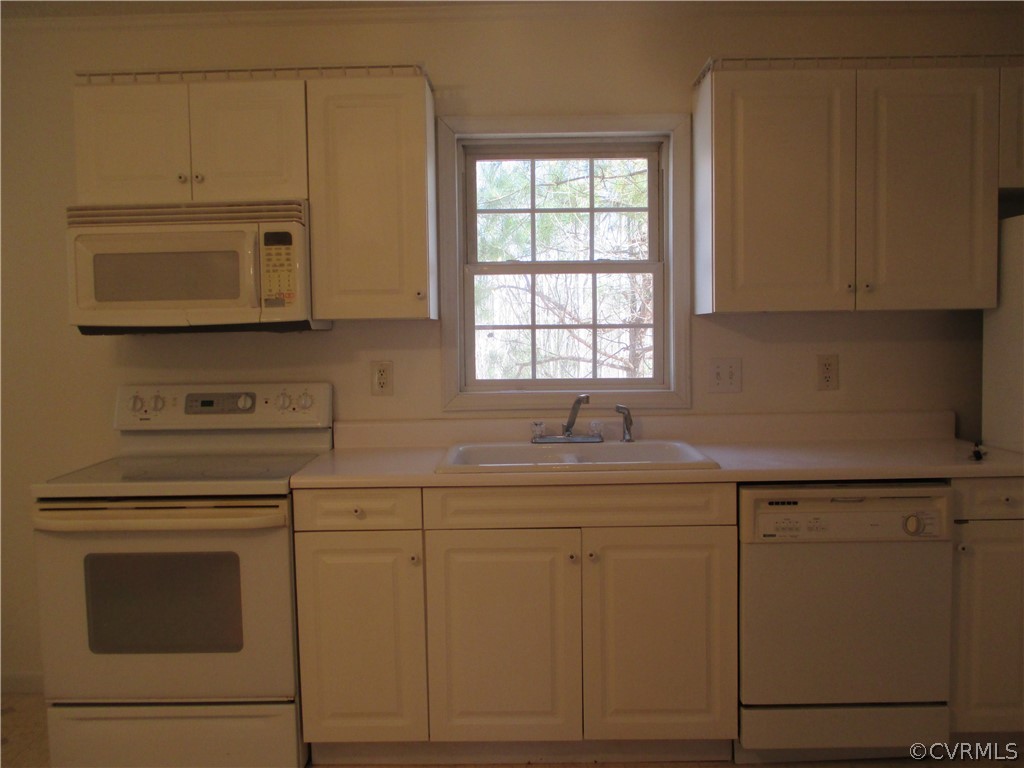 62 Falls Road Victoria, VA 23974 - Photo 23 of 36 a kitchen with cabinets stainless steel appliances and a sink