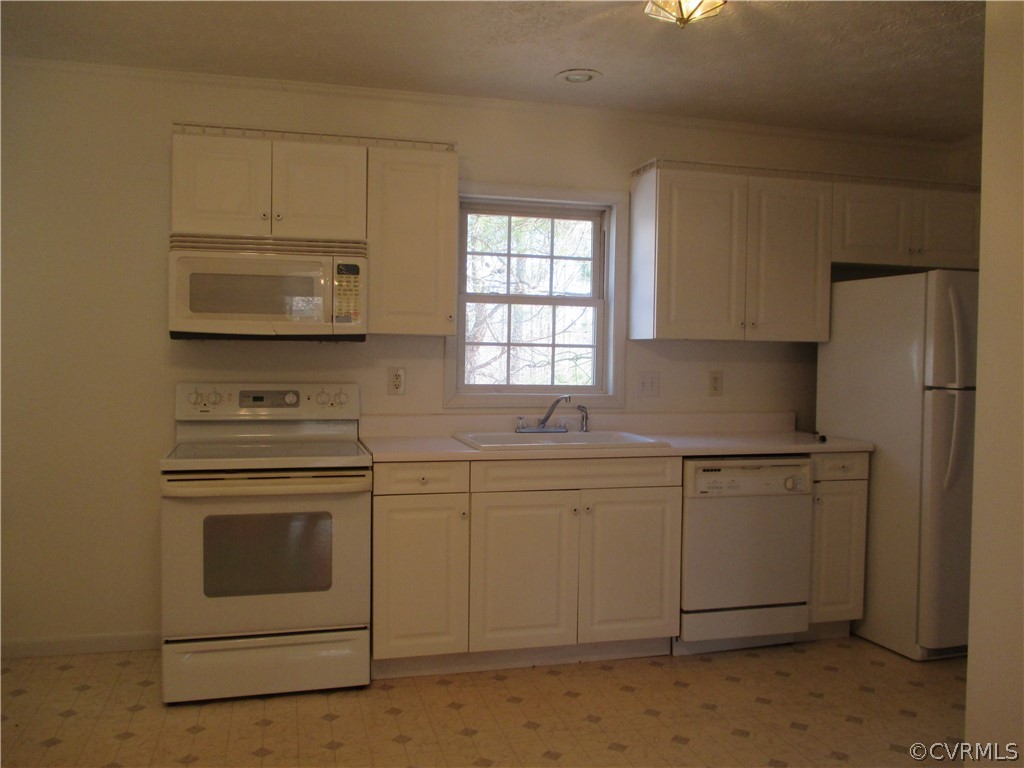 62 Falls Road Victoria, VA 23974 - Photo 24 of 36 a kitchen with cabinets stainless steel appliances and sink