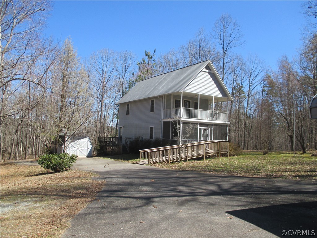 62 Falls Road Victoria, VA 23974 - Photo 5 of 36 a front view of a house with a yard