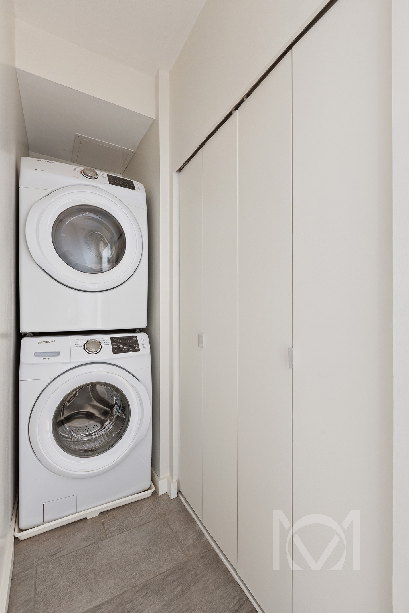 132 Remsen Street, Unit 12 Brooklyn, NY 11201 - Photo 6 of 8 a utility room with dryer and washer