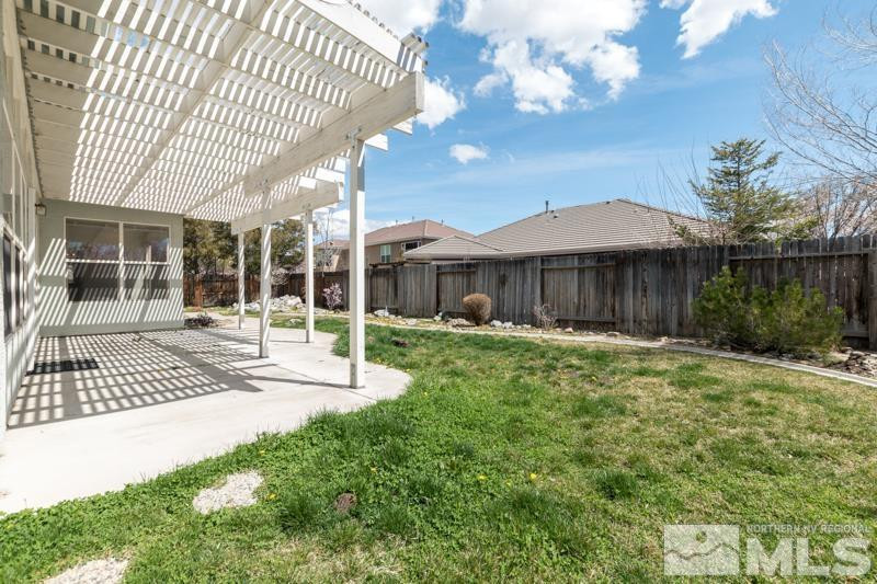 9970 Bandana Way Reno, NV 89521 - Photo 26 of 32 a view of a house with backyard and porch
