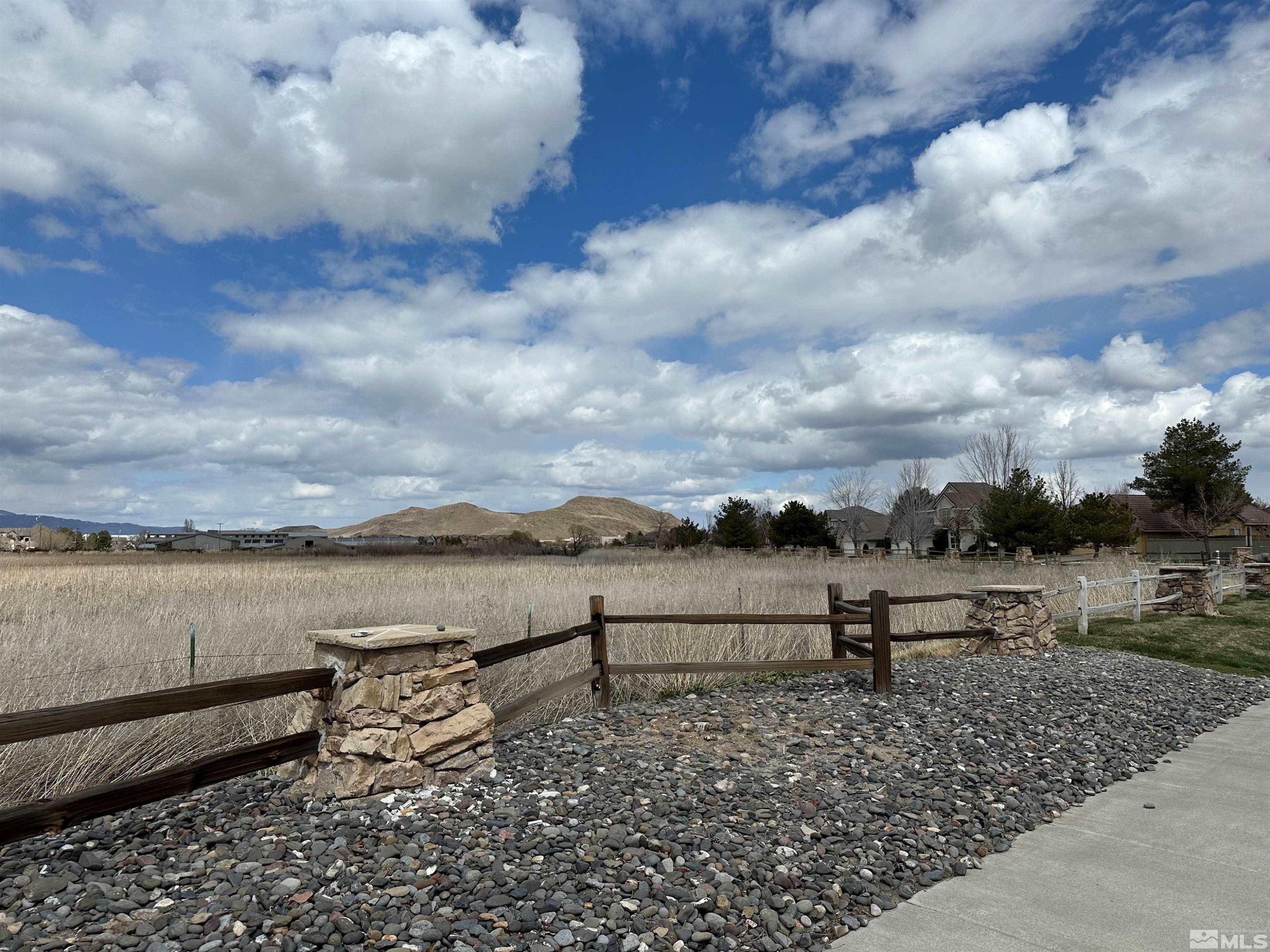 9970 Bandana Way Reno, NV 89521 - Photo 30 of 32 a view of a lake with houses in the back