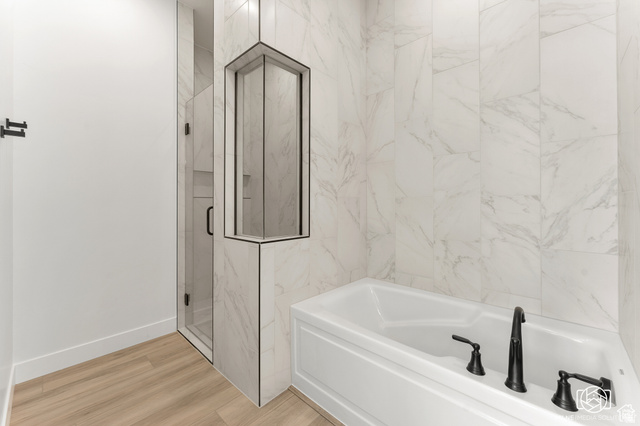 707 Spring Lily Drive St. George, UT 84790 - Photo 26 of 43 White paneled bathtub with matte black fixtures
