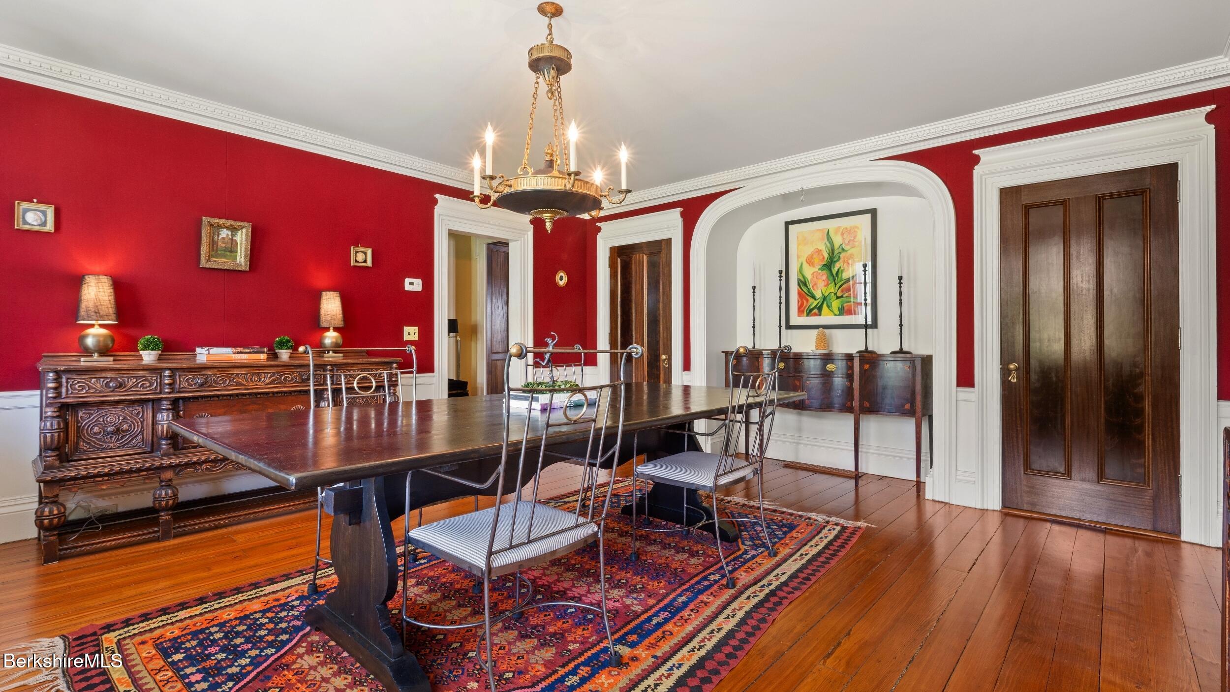 2650 Swamp Road Richmond, MA 01254 - Photo 12 of 49 a view of a dining room with furniture a chandelier and wooden floor
