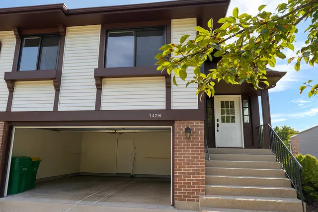 a small hut with trees in front of it