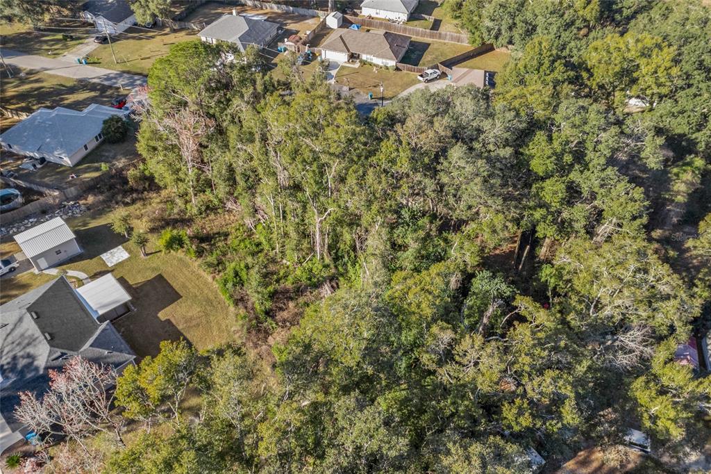 0 Northwest 236th Way High Springs, FL 32643 - Photo 7 of 12 an aerial view of residential house with parking and yard