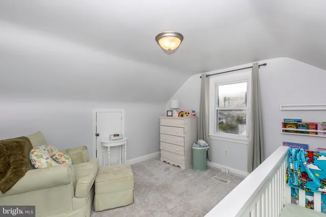 a view of livingroom with furniture and toys