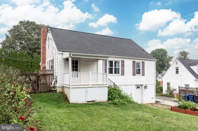 a view of a house with backyard and a slide