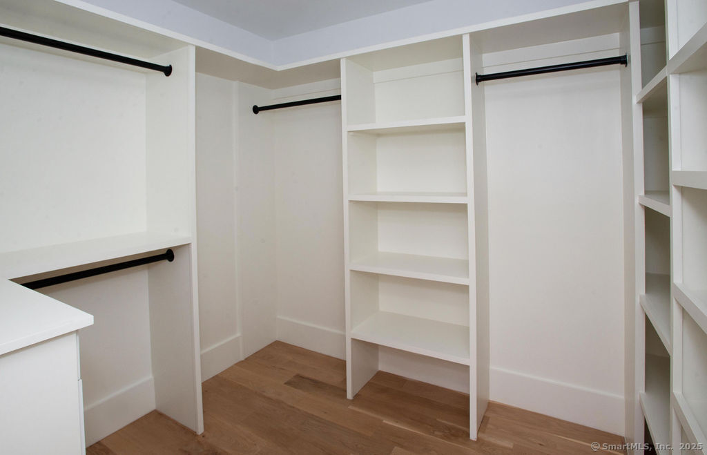 6 Down River Road, Unit B New Canaan, CT 06840 - Photo 16 of 31 a view of walk in closet with empty racks