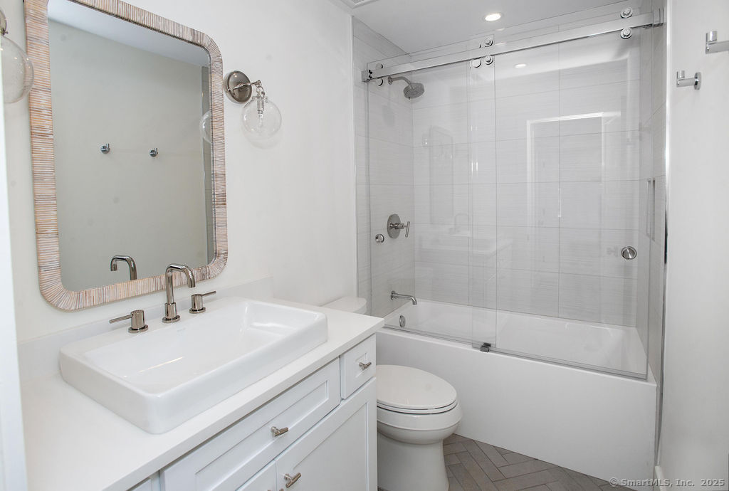 6 Down River Road, Unit B New Canaan, CT 06840 - Photo 21 of 31 a bathroom with a sink a toilet and shower