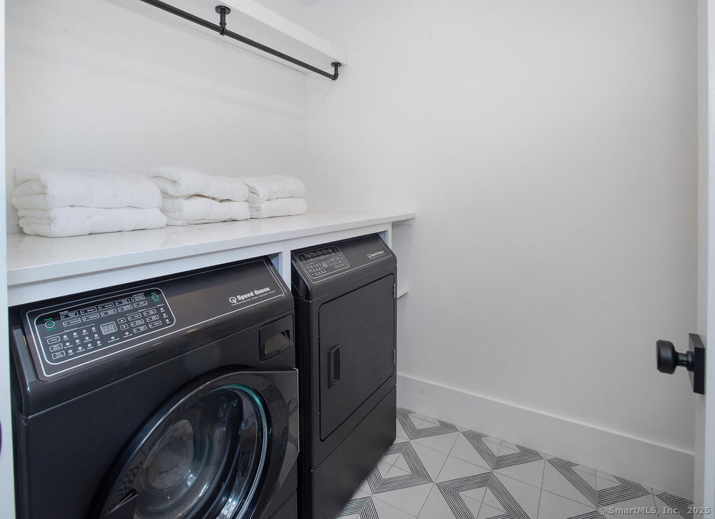 6 Down River Road, Unit B New Canaan, CT 06840 - Photo 22 of 31 a utility room with dryer and washer