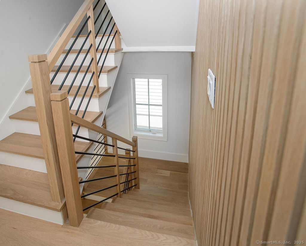 6 Down River Road, Unit B New Canaan, CT 06840 - Photo 26 of 31 a view of staircase with white walls and a window