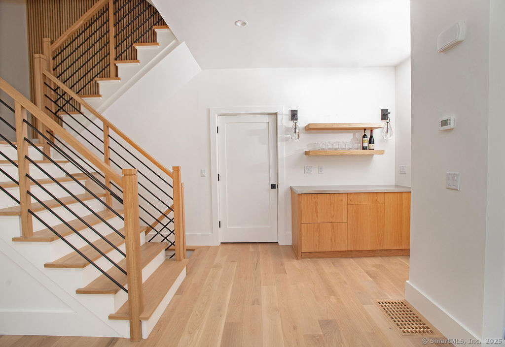6 Down River Road, Unit B New Canaan, CT 06840 - Photo 5 of 31 a view of a room with wooden floor and cabinet