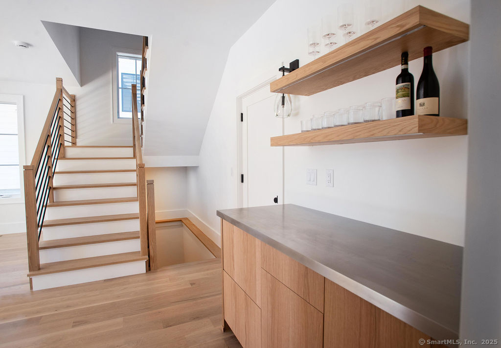 6 Down River Road, Unit B New Canaan, CT 06840 - Photo 9 of 31 a view of entryway and hall with wooden floor